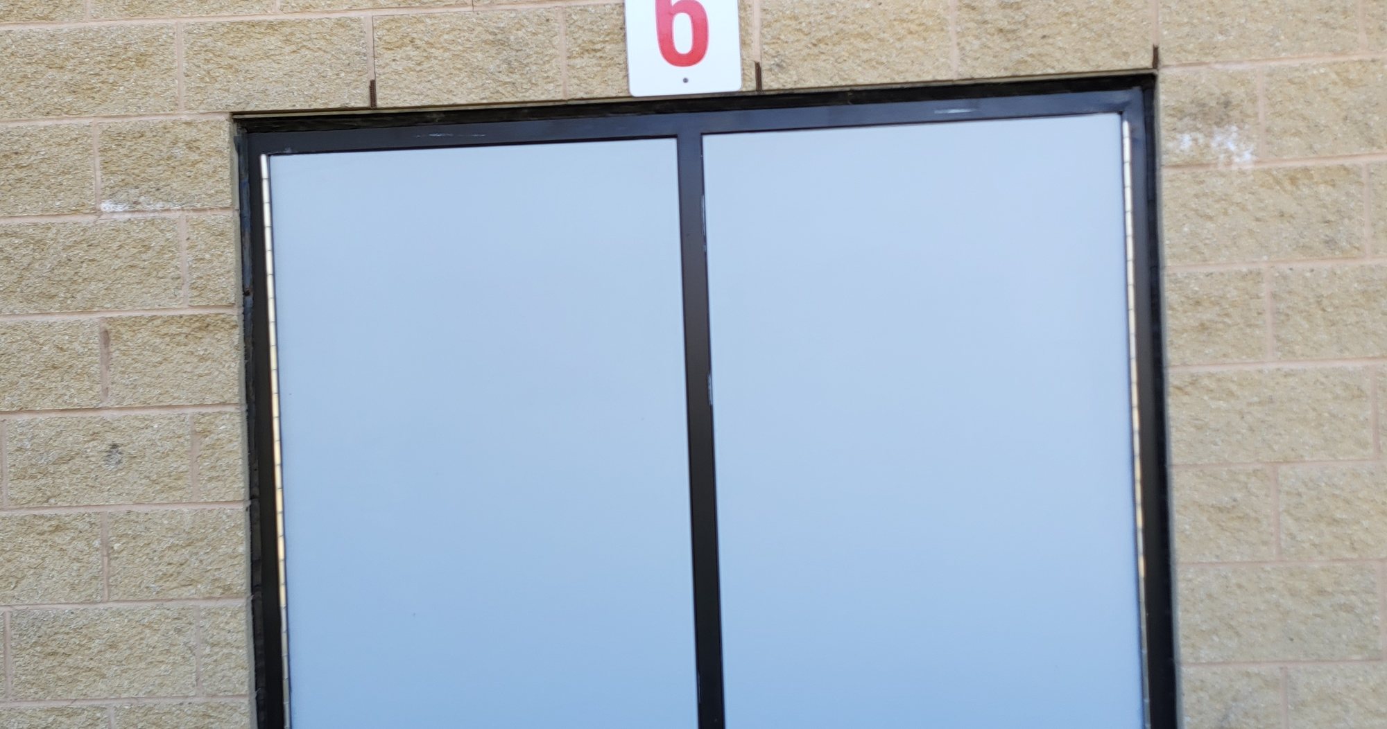 Commercial hollow metal door frame and latch keeper